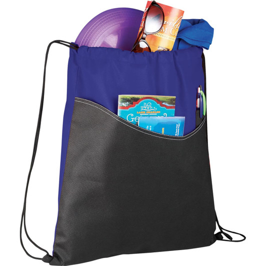 A purple and black non-woven drawstring sportspack filled with a frisbee, sunglasses, and various items.