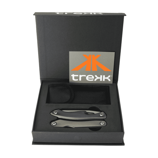 A multi-tool with a sleek metallic finish, presented in a black box with a logo. Includes a storage pouch.