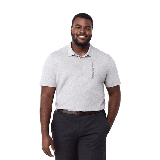 A man wearing a light grey short sleeve polo shirt, featuring a logo, paired with dark trousers.