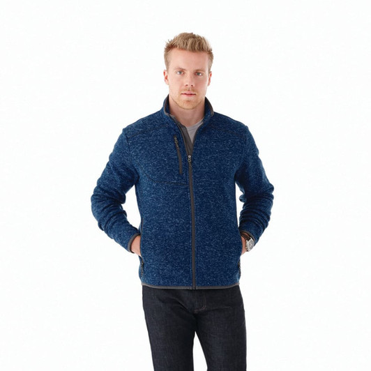 A men's knit jacket in navy blue with a zip front and a chest pocket, featuring a logo on the side.