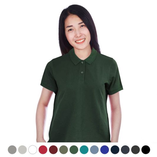 A green women's polo shirt is displayed on a smiling model, featuring a collar and short sleeves.