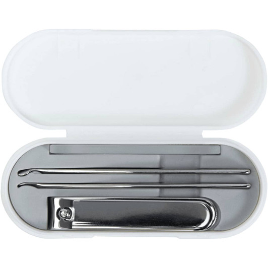A white manicure set case containing metal tools including a nail clipper and two cuticle pushers.