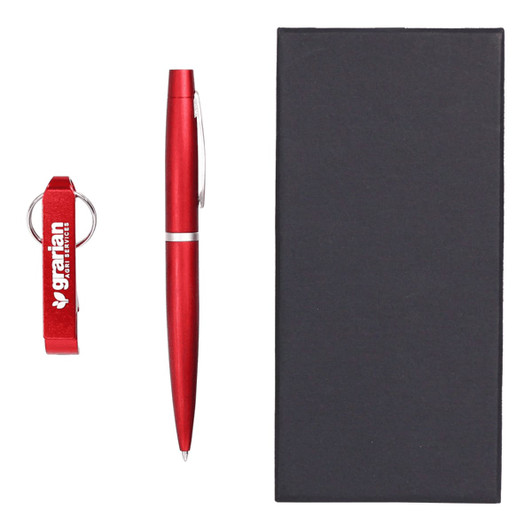 A drink bottle opener keyring and a red pen are displayed alongside a black gift box. The set includes branding.
