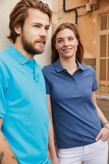 A blue men's polo shirt paired with a blue women's polo shirt, both featuring logos, worn outdoors.