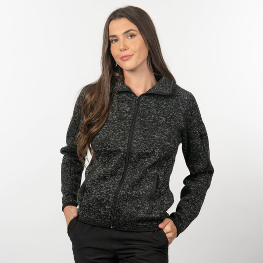 A full zip sweater knit jacket in black with a textured pattern and two side pockets. Features a stylish collar and a logo.