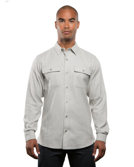 A light grey long sleeve yarn-dyed flannel shirt with button-up front and two chest pockets. It features a logo.