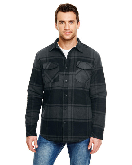 A flannel jacket in black and grey plaid with two chest pockets and a logo, worn by a man.