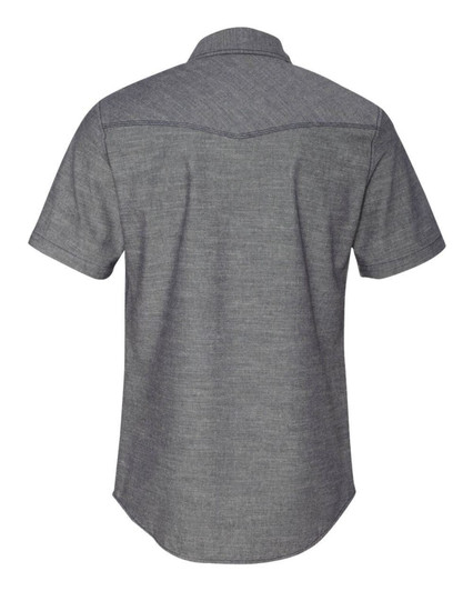 A short sleeve chambray shirt in grey with a collar and a slight curved hem, featuring a logo on the back.