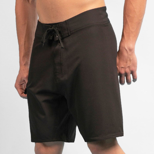 Black 4-way stretch dobby boardshorts with a drawstring waistband, featuring a logo on the side.