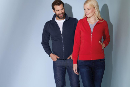 A navy men's jacket and a red women's jacket are displayed on two models against a soft blue background.