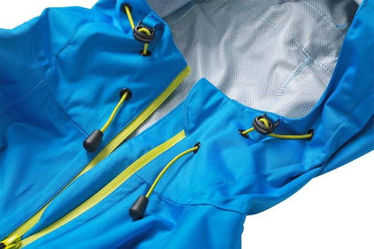 A blue outdoor jacket featuring a hood, zip closure, and contrasting yellow drawstrings. It includes a logo.