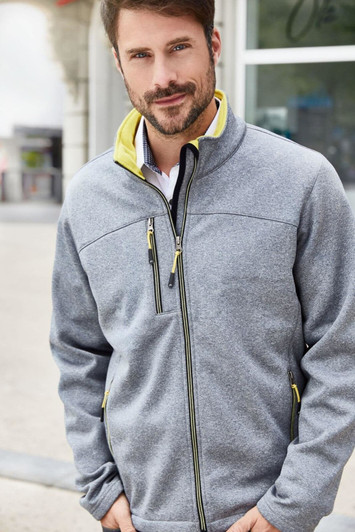 A men's softshell jacket in grey with yellow accents, featuring a zippered front and pockets. It has a logo on the chest.