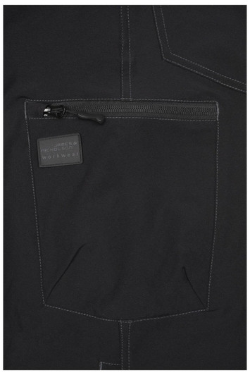 A close-up of black workwear pants featuring a zip pocket and contrasting stitching, with a logo on the pocket.