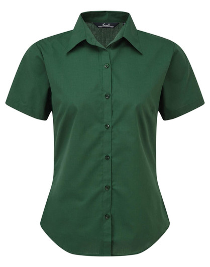 A green women's short-sleeve button-up blouse featuring a collar and a front button closure.