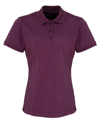 A women's polo shirt in deep purple, featuring a collar and three-button placket. Includes a logo on the chest.