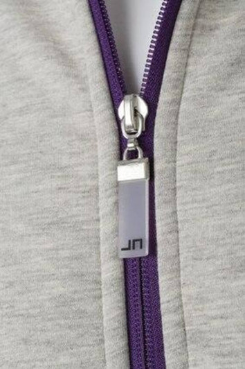 A grey jacket featuring a purple zipper and a logo on the zipper pull.