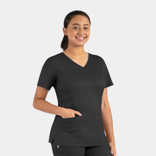 A woman wearing a black Matrix Women's Double V-Neck Top, featuring a pocket and a modern fit.