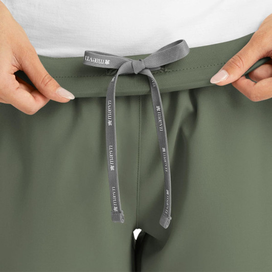 A pair of women's yoga joggers in olive green, featuring a grey drawstring at the waist and a logo.