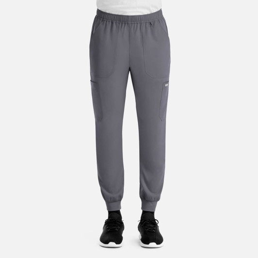 Full elastic joggers in grey with side pockets and elasticised cuffs, featuring a logo on the left leg.