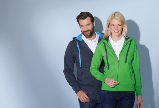A green ladies hooded jacket with a blue trim, displayed alongside a grey jacket. Both models are wearing polo shirts.