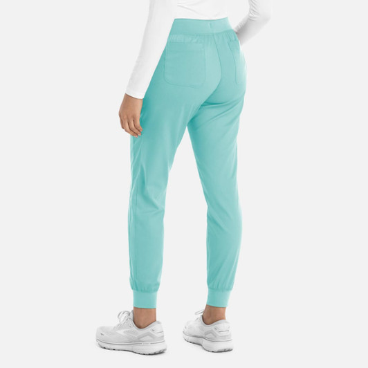 A pair of women's jogger pants in a light turquoise colour with cuffed ankles and two back pockets.