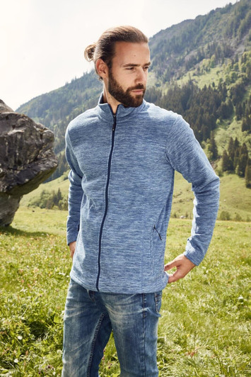 A men's polar fleece jacket in blue, featuring a zip closure and side pockets, worn outdoors against a natural backdrop.