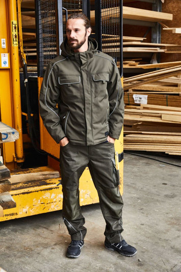 A padded work jacket in khaki, featuring a hood and multiple pockets, worn by a man in a warehouse setting.
