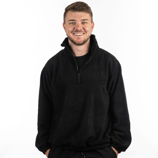 A black 1/4 zip polar fleece pullover worn by a smiling man, featuring a high collar and relaxed fit.