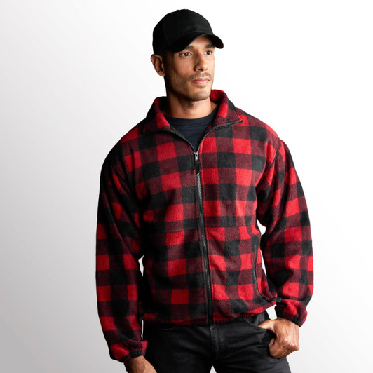 A man wearing a red and black checked full zip polar fleece jacket, paired with a black cap.