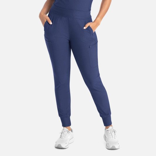 A pair of navy mid-rise joggers with pockets and elastic cuffs, accompanied by a person wearing them.