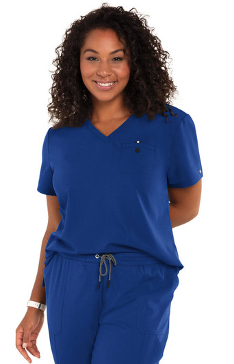A woman wearing a blue "Ready to Work Top" with a V-neck and a chest pocket, smiling at the camera.