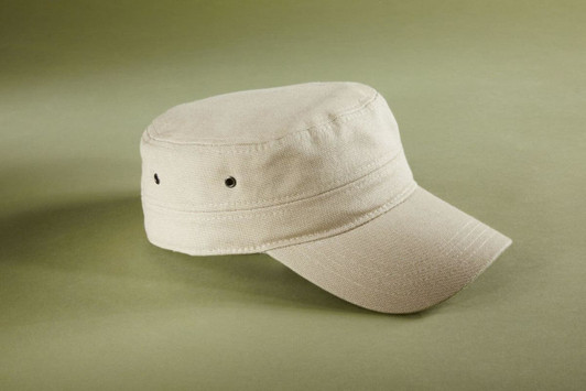 A beige military cap with a flat crown and extended peak, featuring subtle vent holes and a logo.