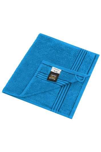 A blue hand towel with a textured surface and striped design, featuring a label and a hanging loop.