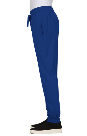 A pair of royal blue jogger pants with an elastic waistband and pockets, worn with black shoes.