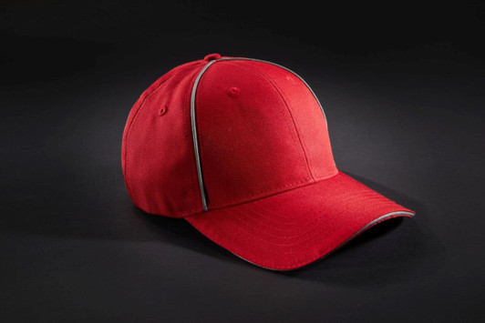 A red six-panel cap with contrasting trim and a logo. Ideal for workwear or casual wear.