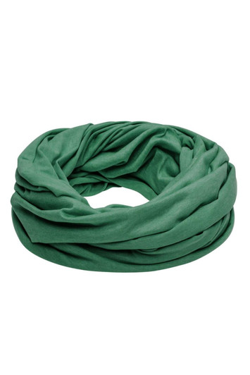 A green loop scarf made from soft fabric, elegantly draped and swirling in a circular shape.