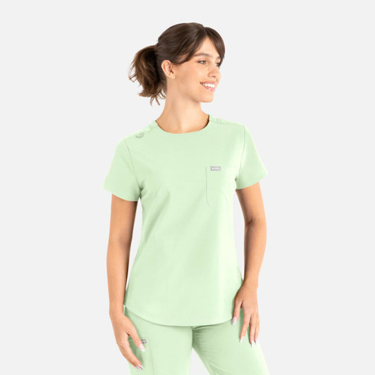 A light green round neck top designed for uniforms, featuring a pocket and decorative buttons. It includes a logo.