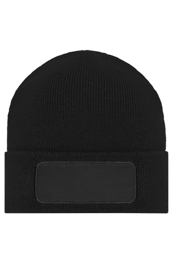 A black knitted beanie featuring a patch area for customisation. The beanie has a close-fitting design.