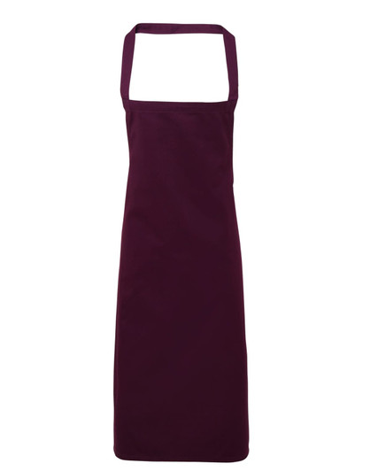 A deep burgundy organic cotton bib apron with adjustable neck straps and no visible logos.