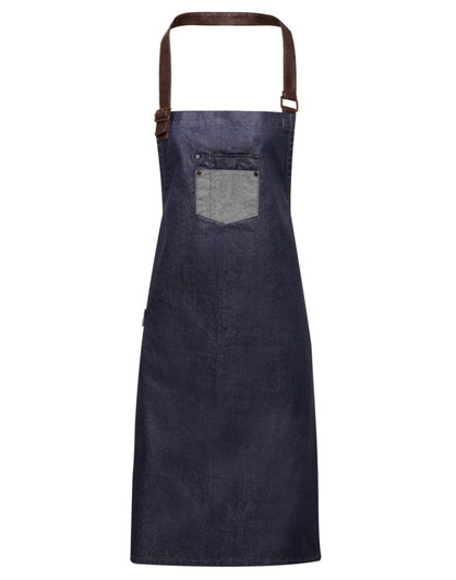 A navy denim bib apron with a brown strap and a pocket. The apron has a simple yet stylish design.