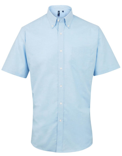 A short-sleeve button-up shirt in light blue with a pocket and a logo on the collar.