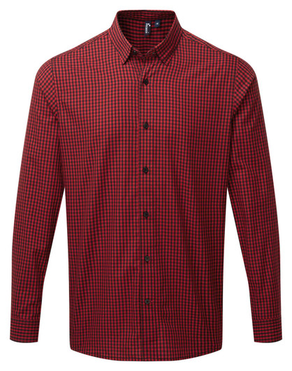 A red and black checked button-up shirt with long sleeves and a collar, featuring a logo.