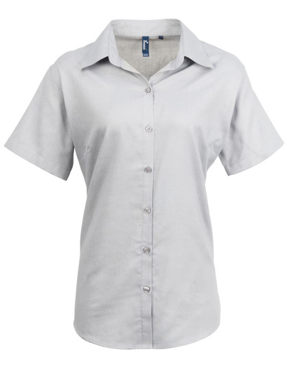 A light grey button-up shirt with a collared neckline and short sleeves. It features a logo on the chest area.