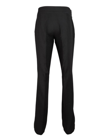 Black straight leg trousers with a fitted waistband and a sleek design, featuring a logo on the back.