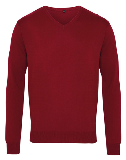 A red V-neck sweater with long sleeves and a ribbed hem, featuring a logo on the label.