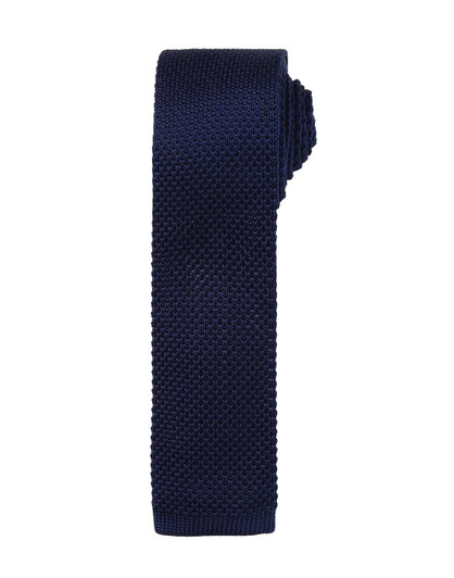 A slim knitted tie in a deep navy blue colour, featuring a textured pattern and a branding logo.