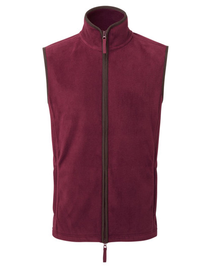 A maroon artisan fleece vest with a high collar and front zip, featuring a contrasting zip trim.