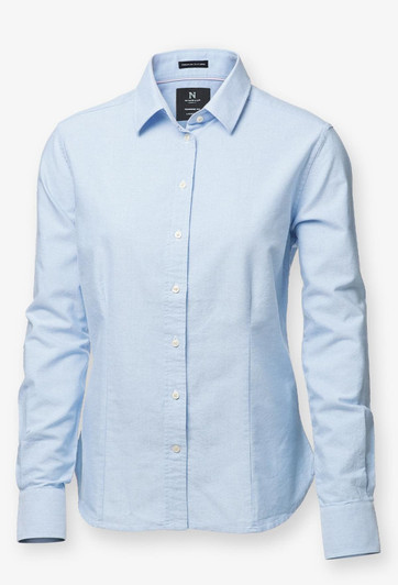 A light blue button-up shirt with long sleeves and a collar, featuring a branded tag.