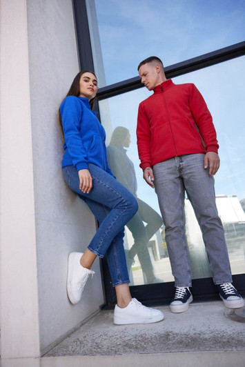 A blue and a red ladies' bonded fleece jacket displayed on models, with casual attire and footwear.