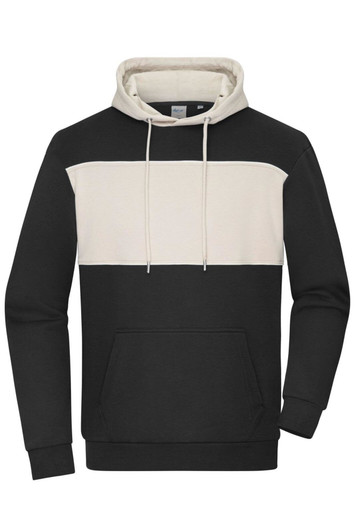 A colour-block hoodie featuring a black lower section and a cream upper panel, with a front pocket and drawstring hood.